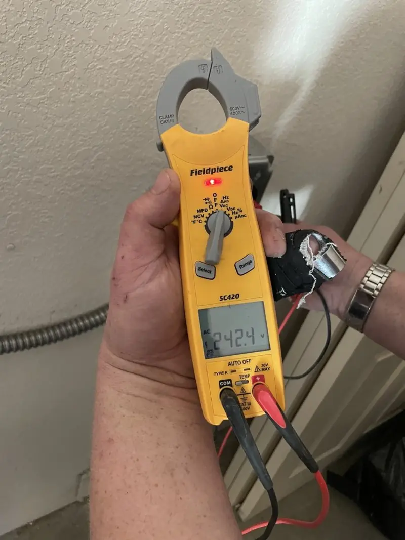 Voltage testing with clamp meter during Recessed Lighting Installation in North Barrington